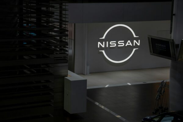 Nissan logo illuminated on a dark background