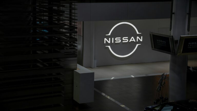 Nissan logo illuminated on a dark background