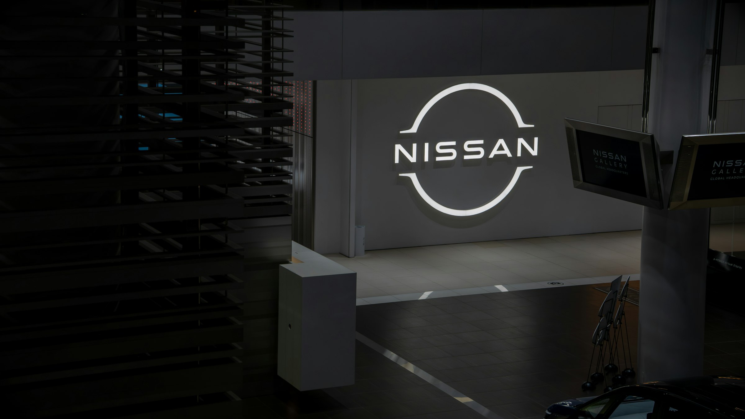 Nissan logo illuminated on a dark background