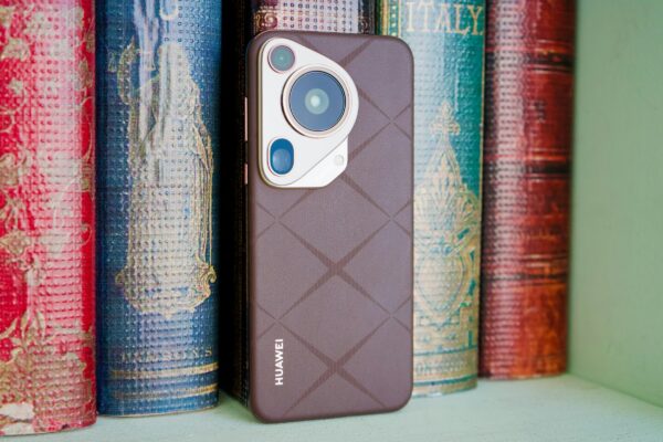 A close up of a cell phone on a shelf