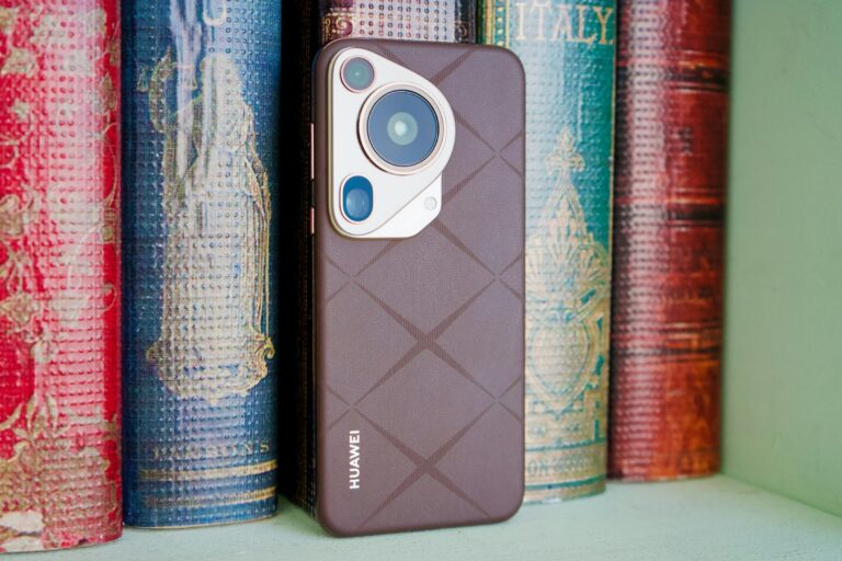 A close up of a cell phone on a shelf