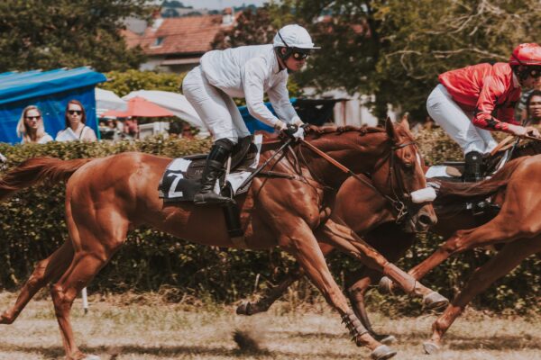 person riding running horse
