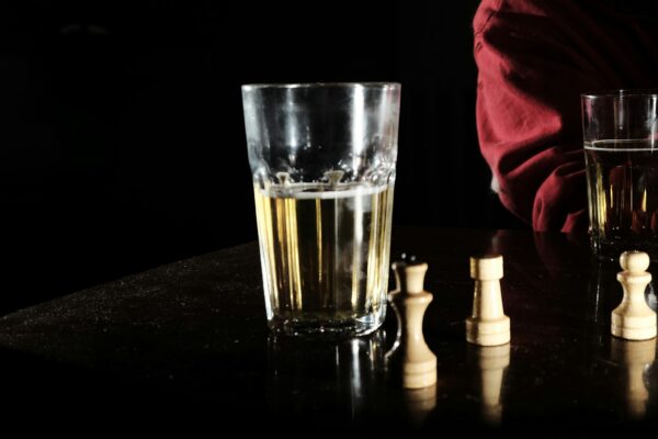 clear drinking glass on black table