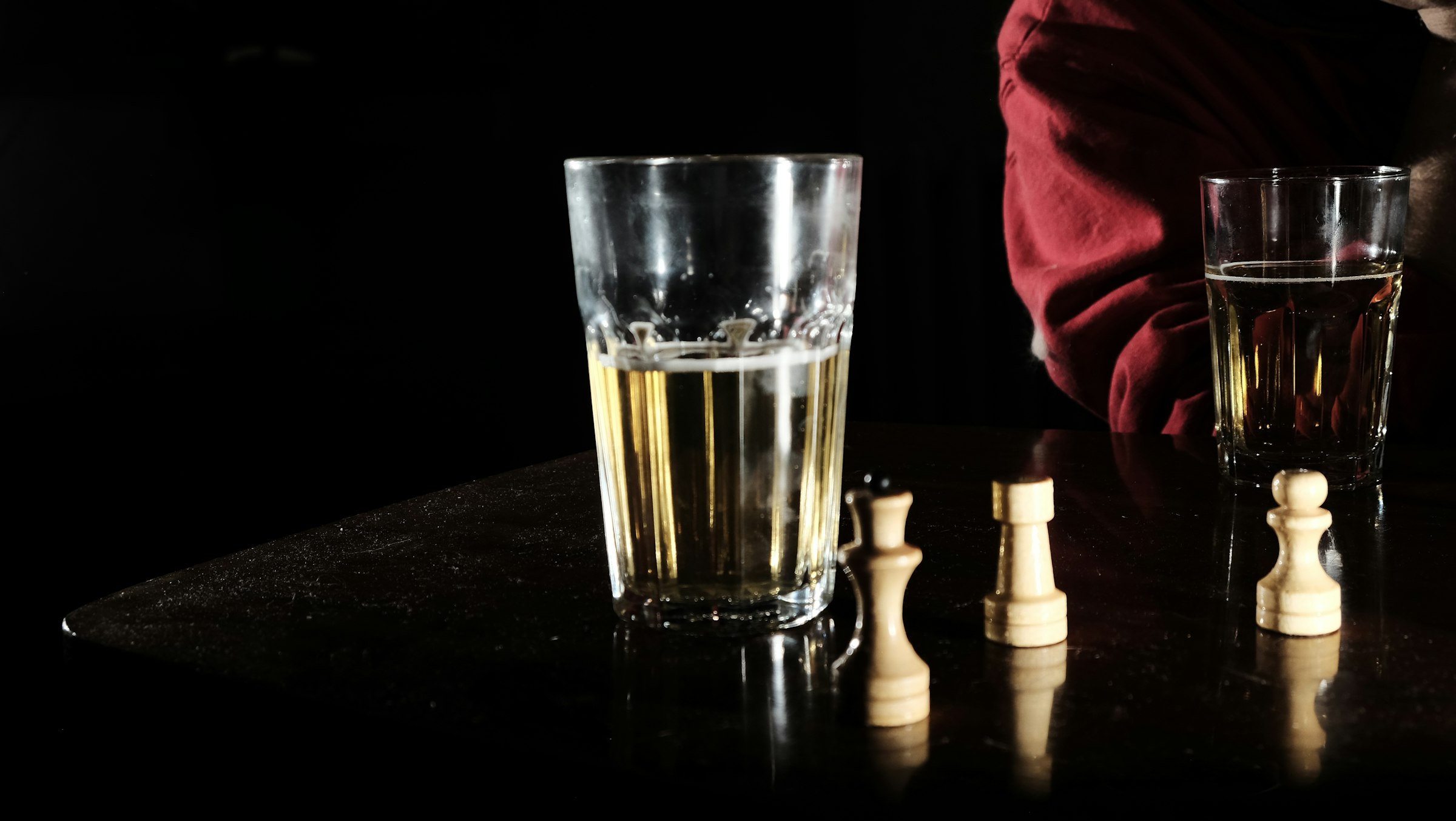 clear drinking glass on black table