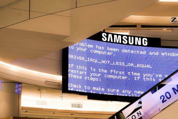 black Samsung flat screen monitor turned-on displaying boot sequence error