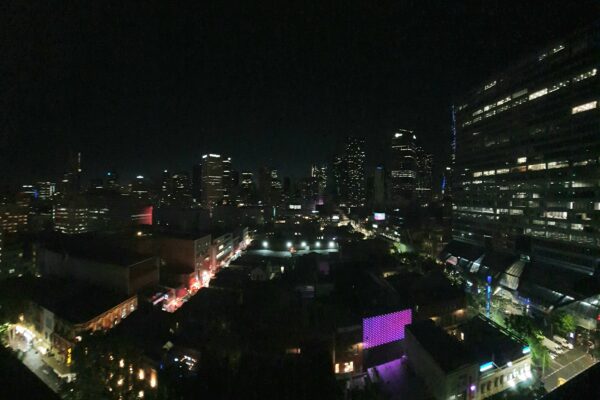 a view of a city at night from the top of a building