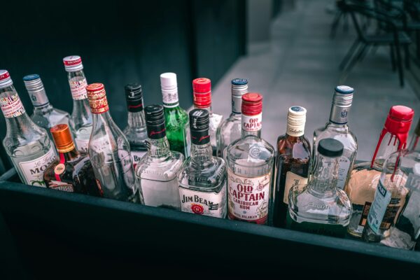 a bunch of liquor bottles sitting on top of a table