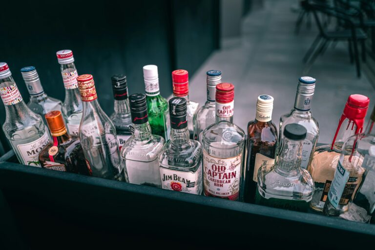 a bunch of liquor bottles sitting on top of a table