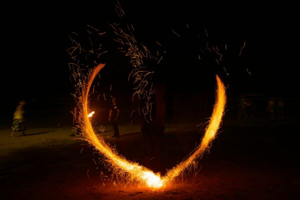 A heart shaped fire show in the dark