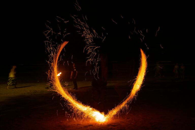 A heart shaped fire show in the dark