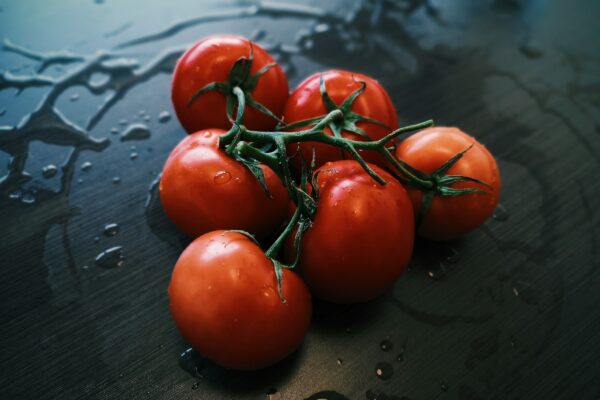 red tomatoes on black table
