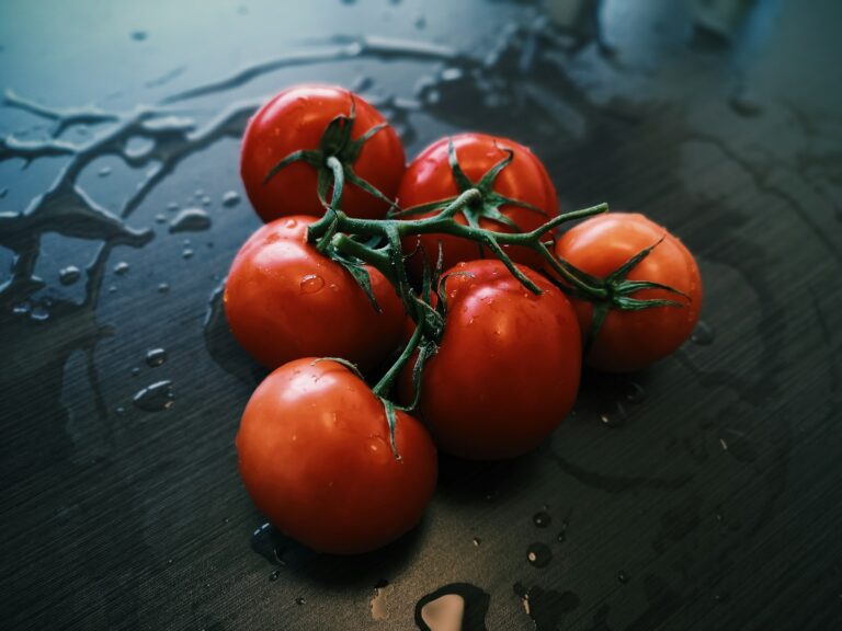 red tomatoes on black table