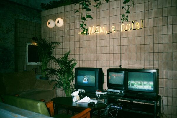 black crt tv on brown wooden table