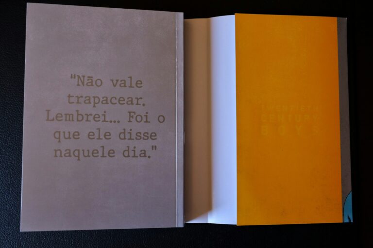 Open book with text on cover and orange pages.