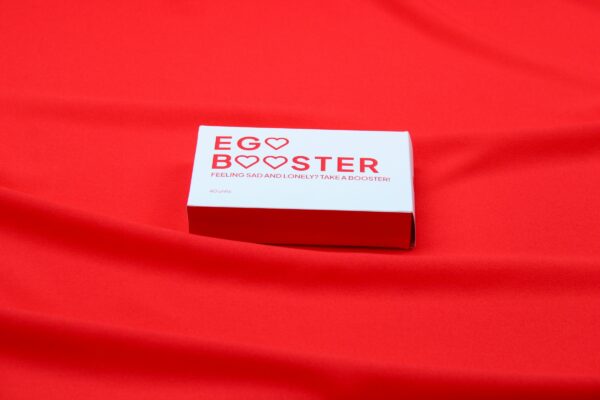 A red cloth with a business card on it