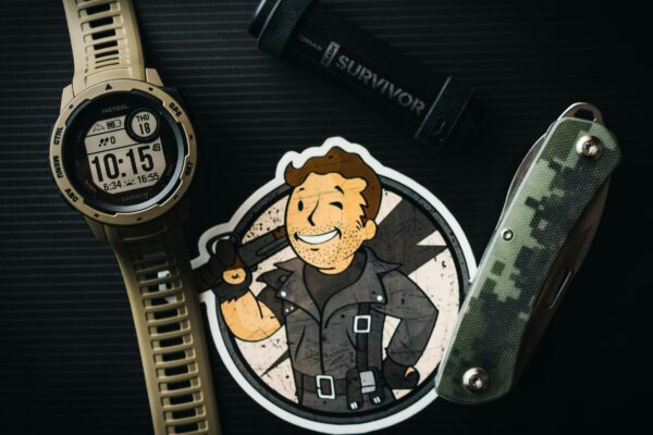 a watch and a sticker with a picture of a man