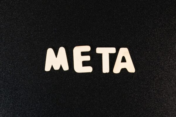 a close up of a black surface with white letters