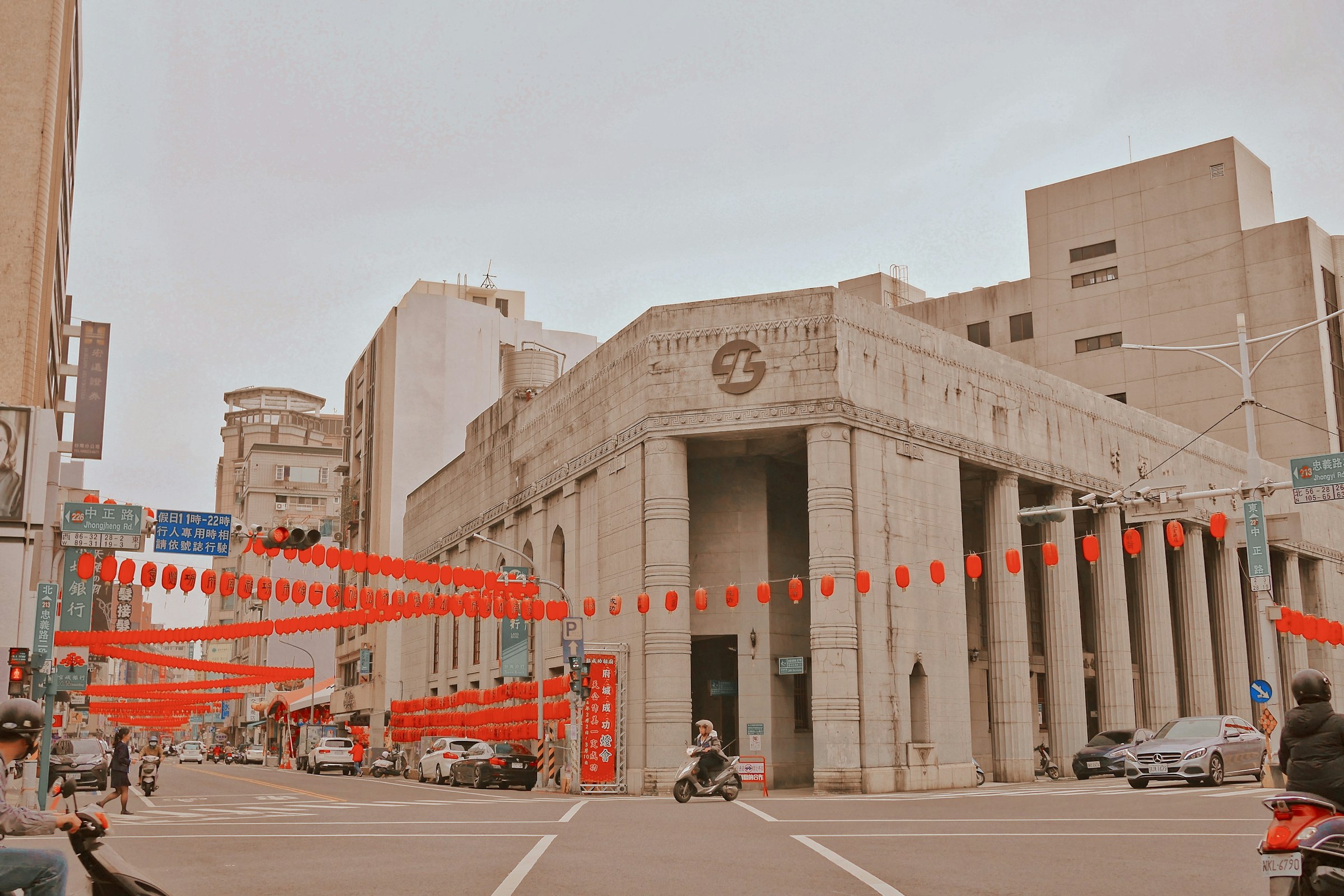 A bank building decorated with red decorations.