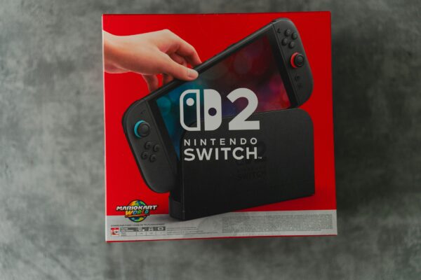 A person is holding a nintendo switch.