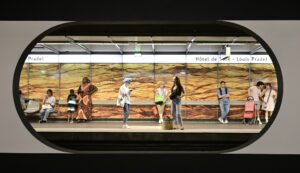 A group of people standing on a train platform