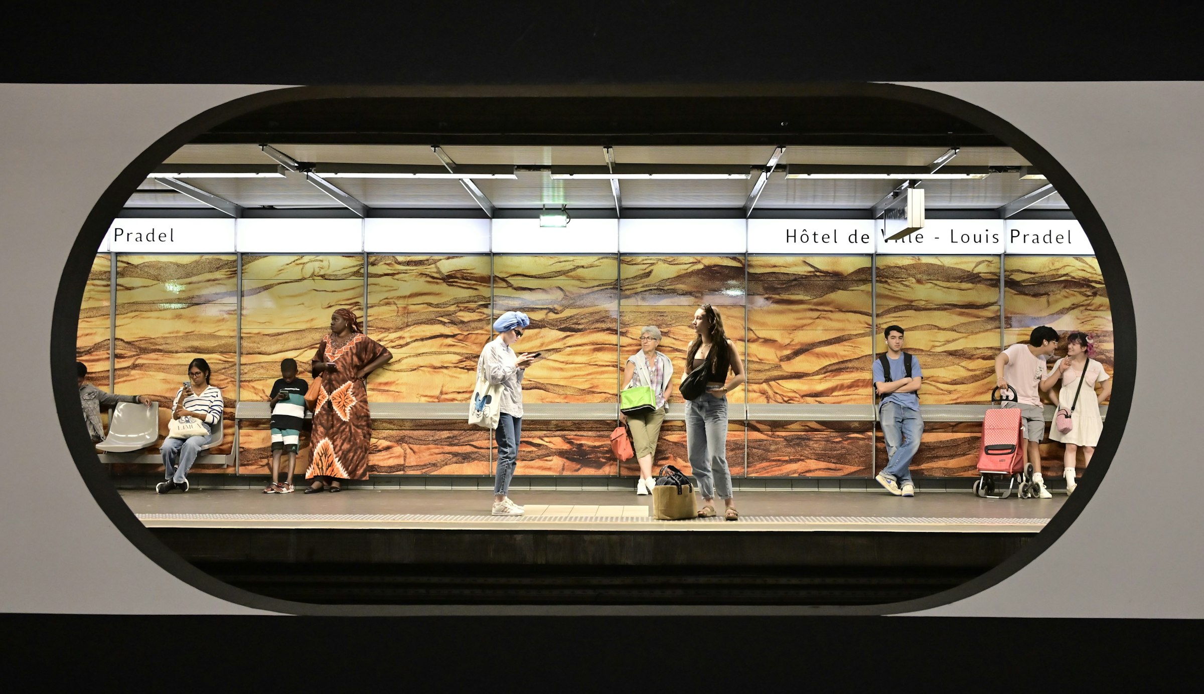 A group of people standing on a train platform