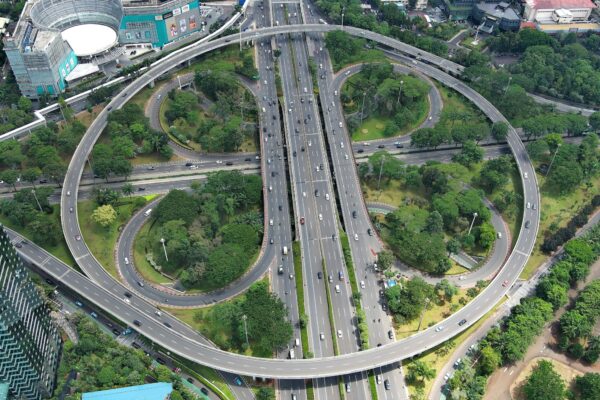 an aerial view of a highway intersection in a city