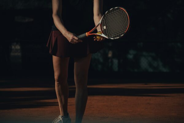 a woman holding a tennis racket