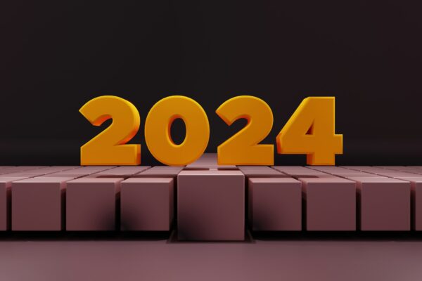 a yellow number sitting on top of a block wall