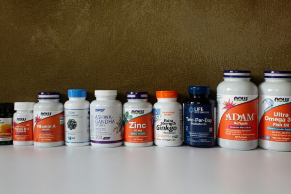 a row of bottles of different types of vitamins