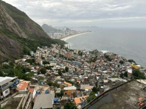 a view of a large city next to the ocean