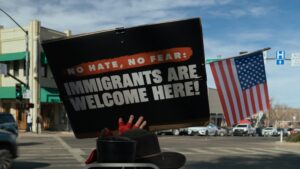 Protest sign reads immigrants are welcome here