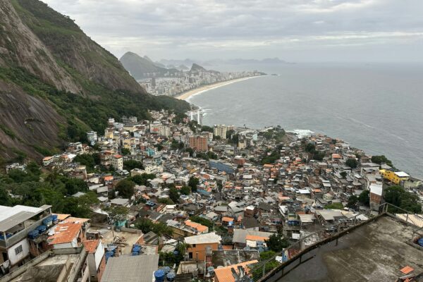 a view of a large city next to the ocean