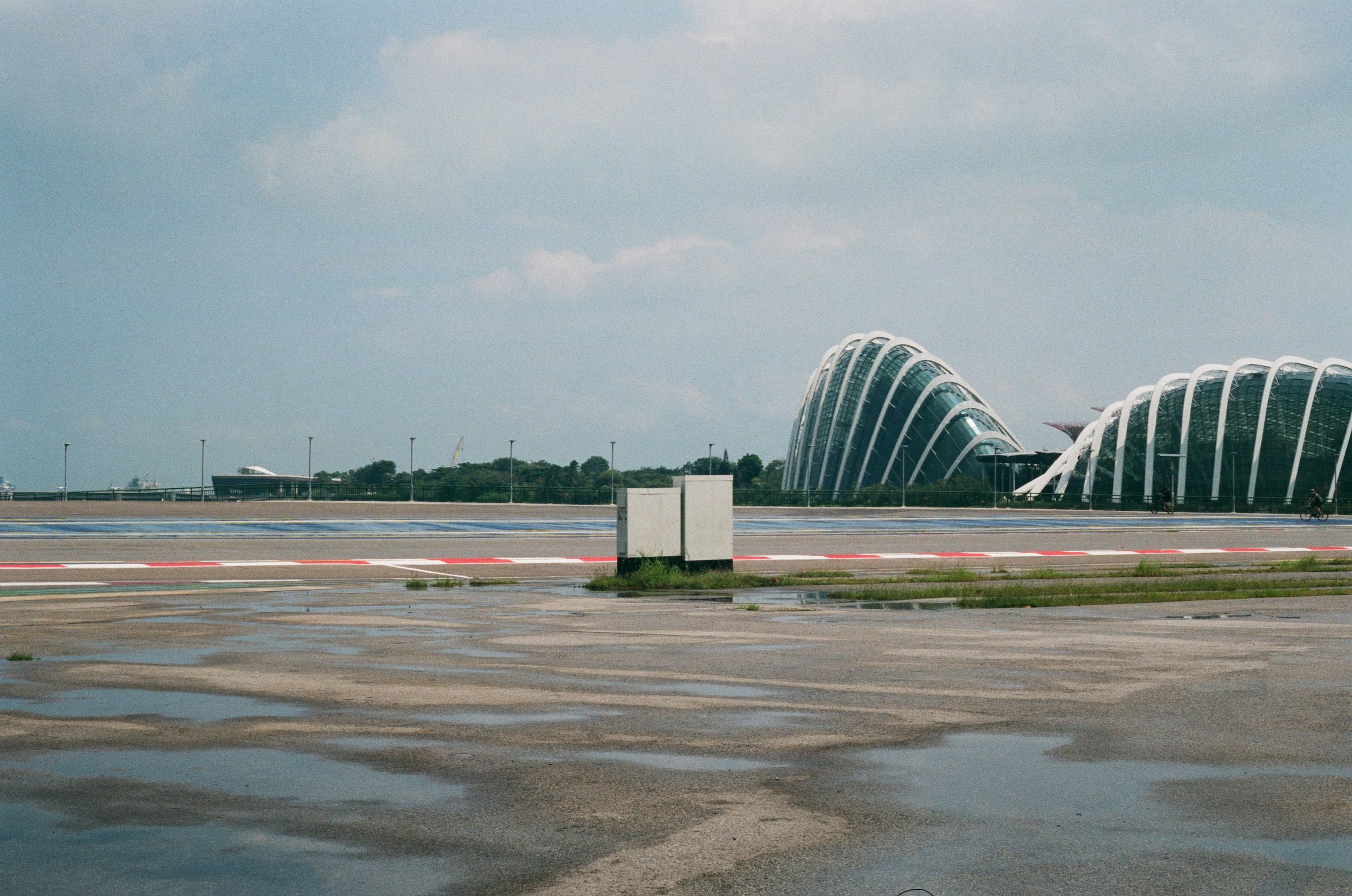 a large building sitting on top of an airport tarmac