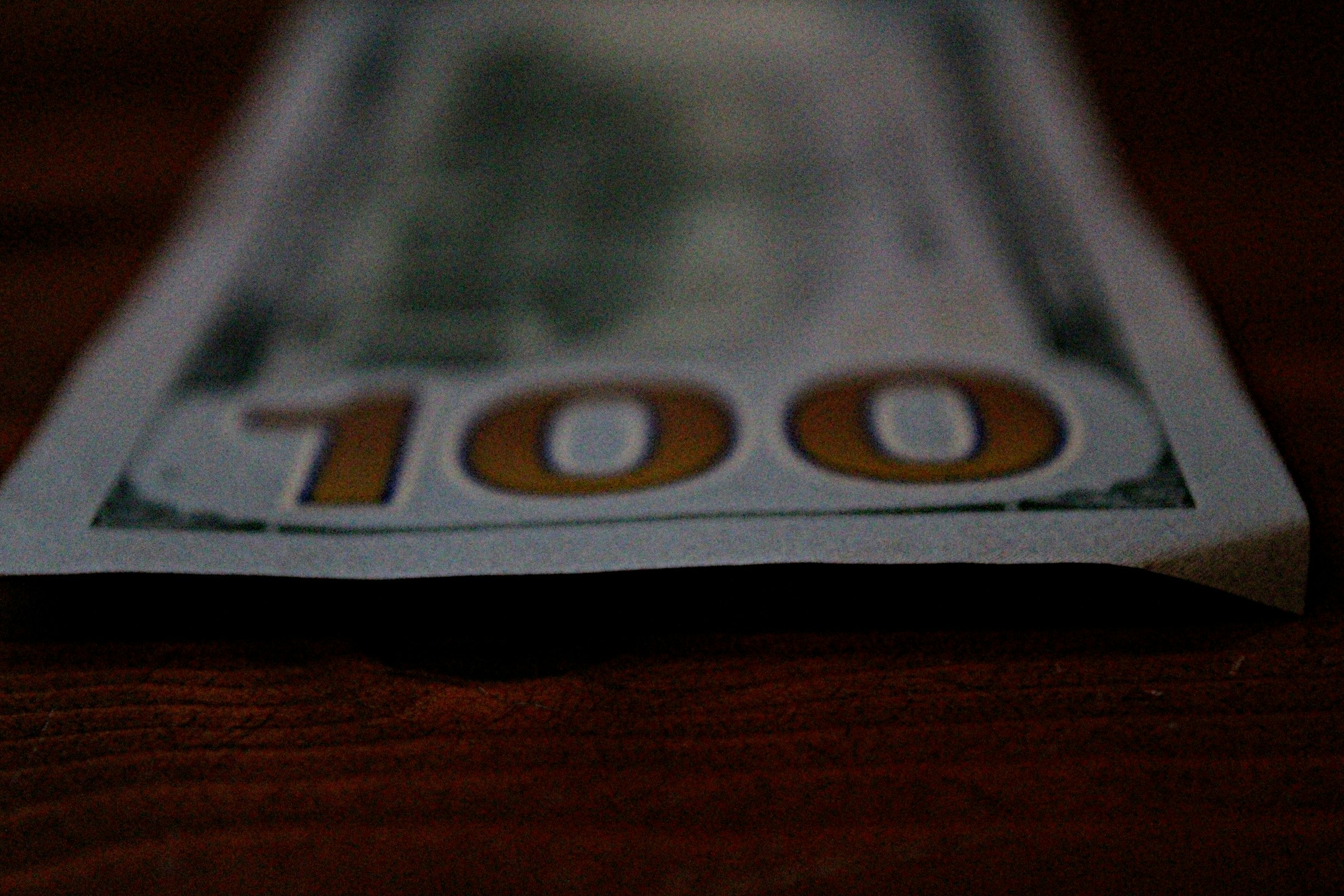 a close up of a hundred dollar bill
