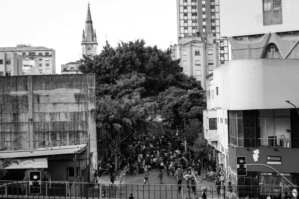 a crowd of people walking on a street