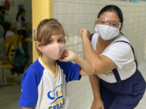 boy in white crew neck t-shirt wearing white mask