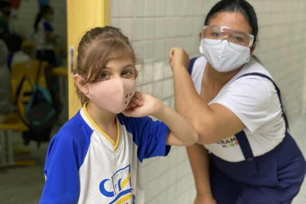 boy in white crew neck t-shirt wearing white mask