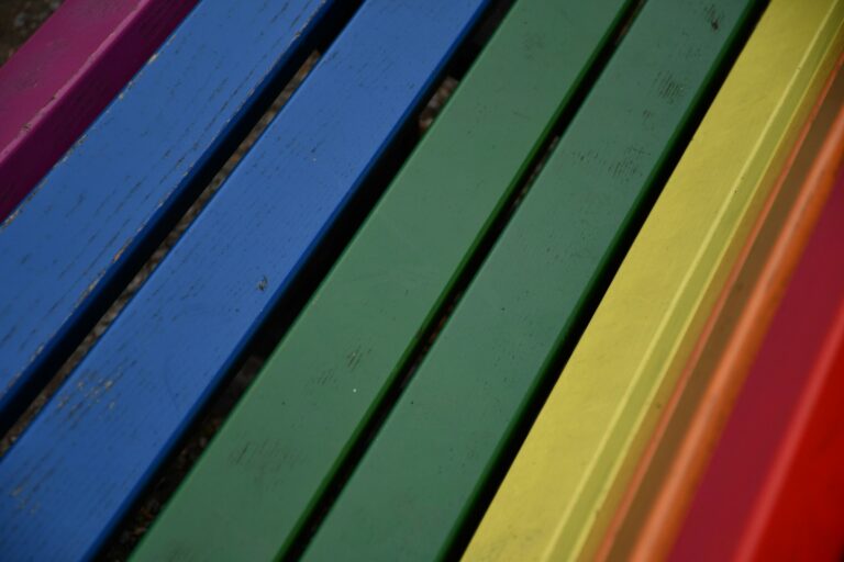 a close up of a rainbow colored wall