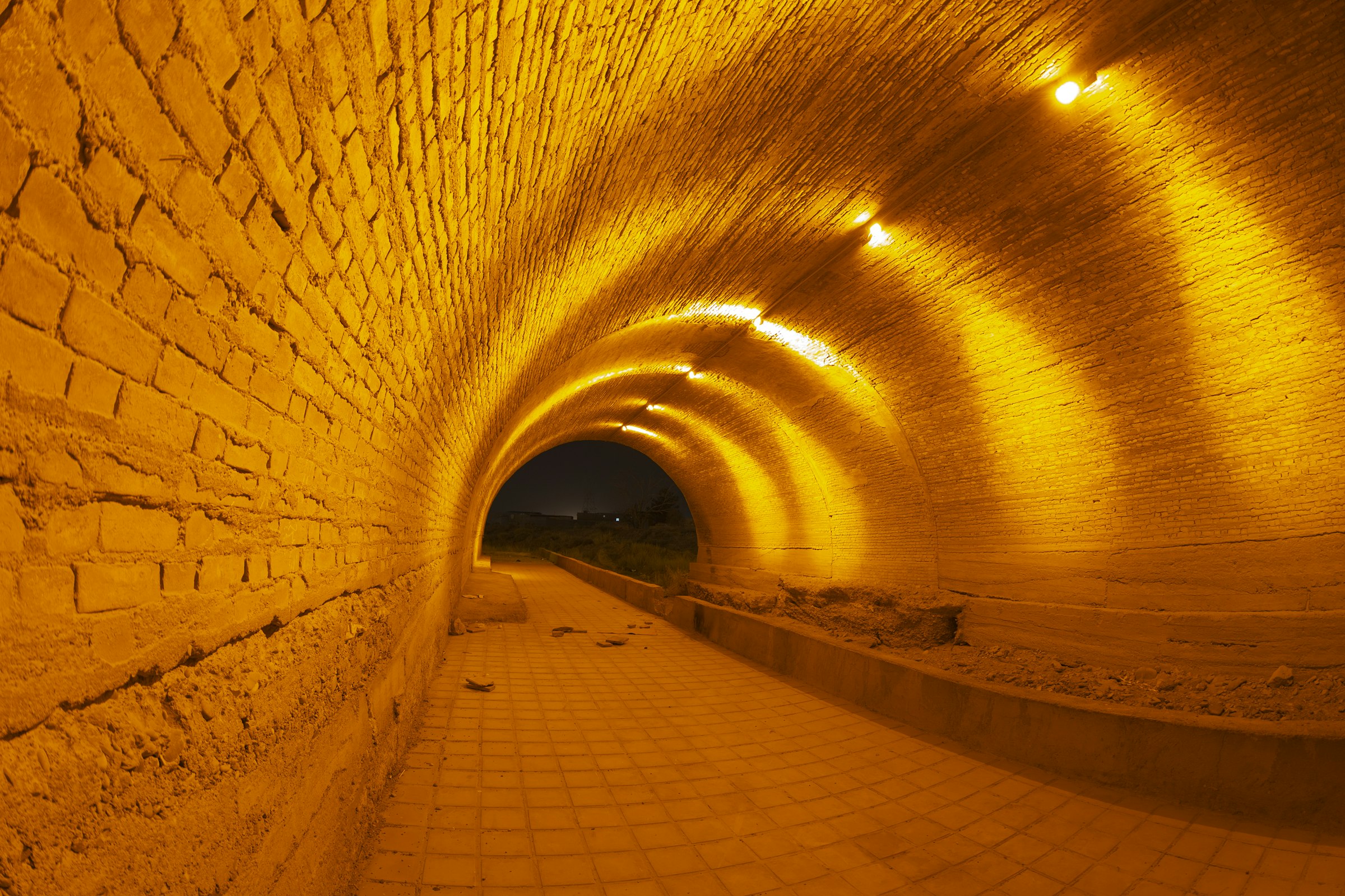 a long tunnel with a light at the end