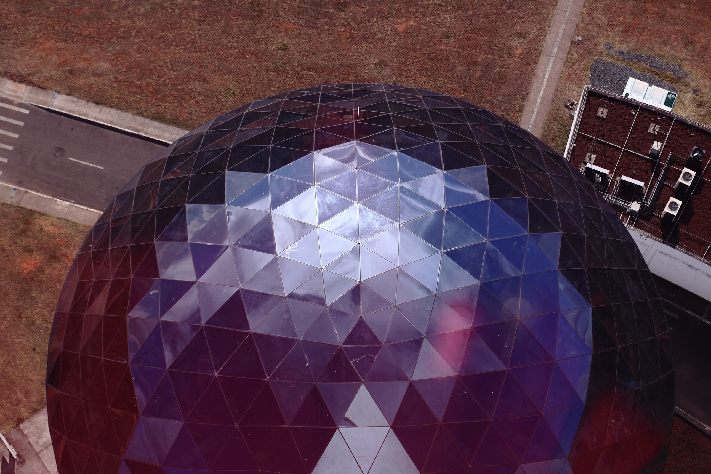 an aerial view of a large object in the middle of a field