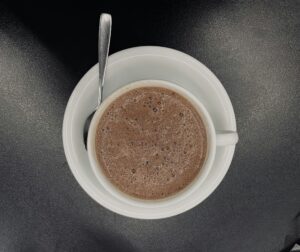 a cup of coffee with a spoon in it