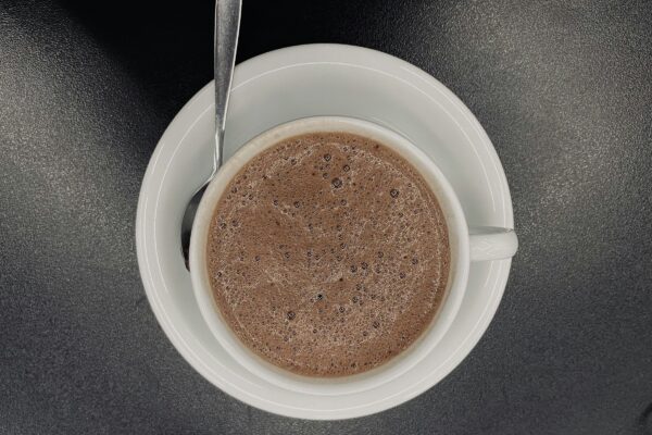 a cup of coffee with a spoon in it