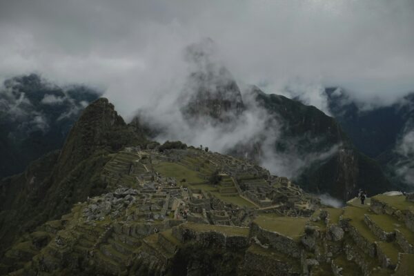 green and brown mountain under white clouds during daytime