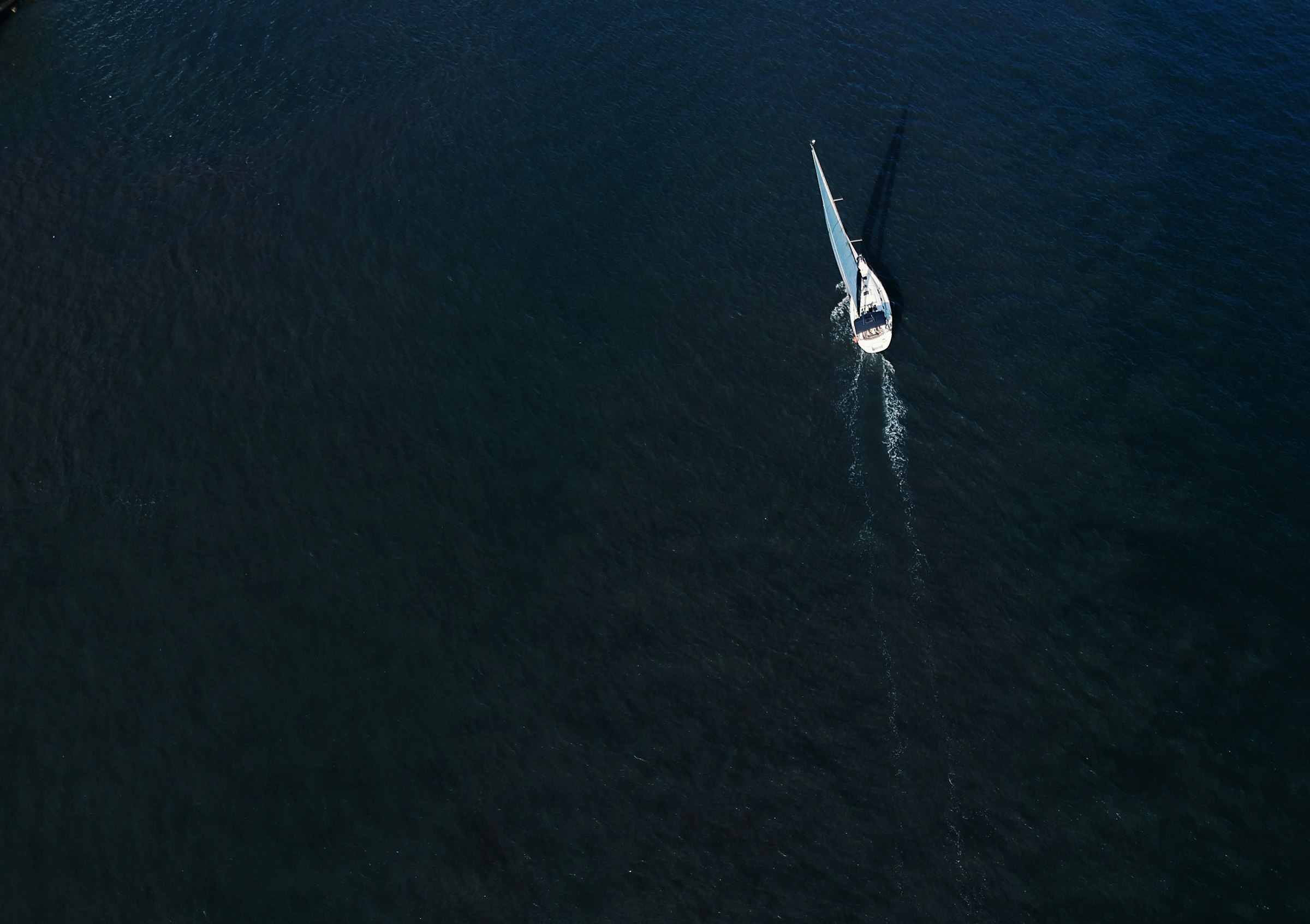 a small boat in a large body of water