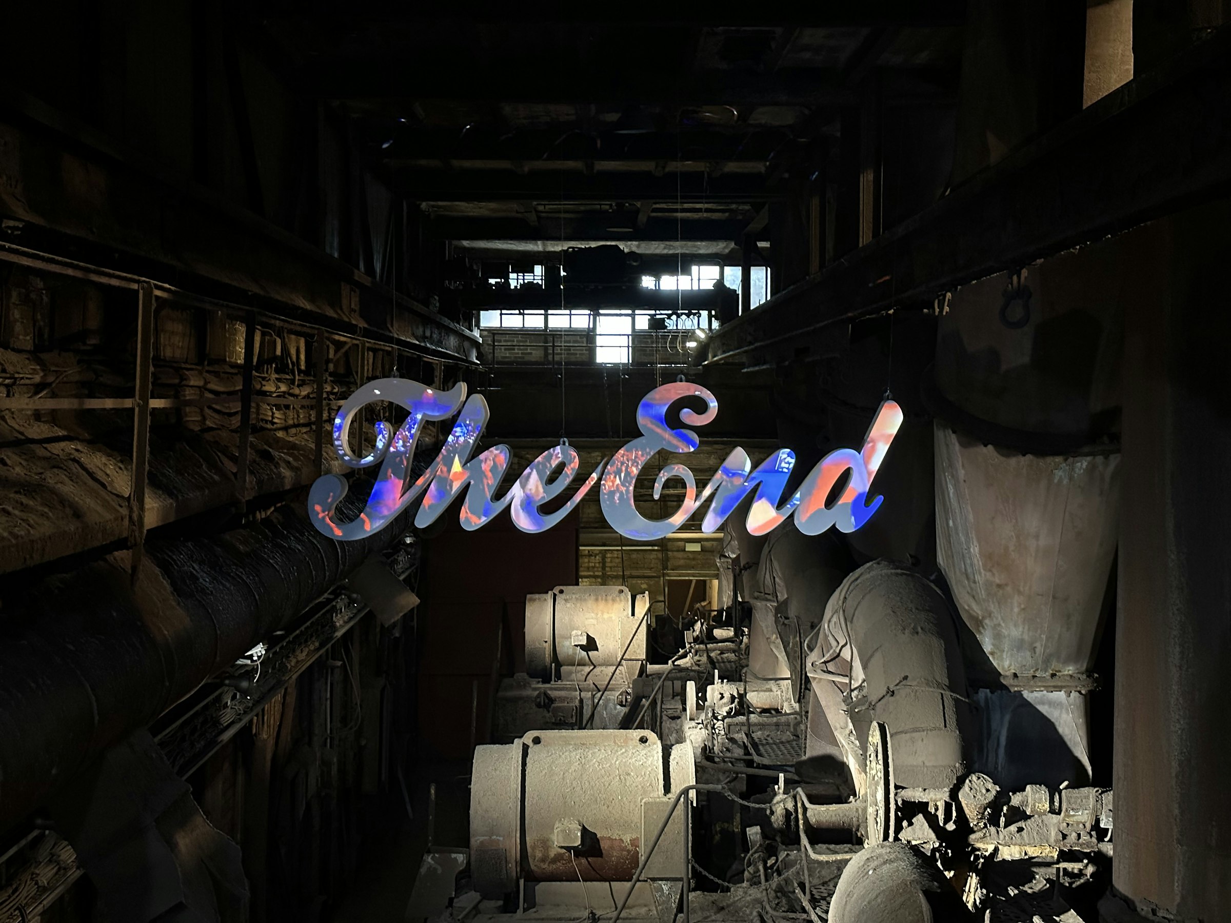 a sign that reads the end in a dark room