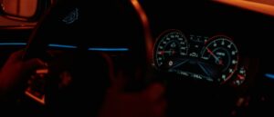the dashboard of a car in the dark