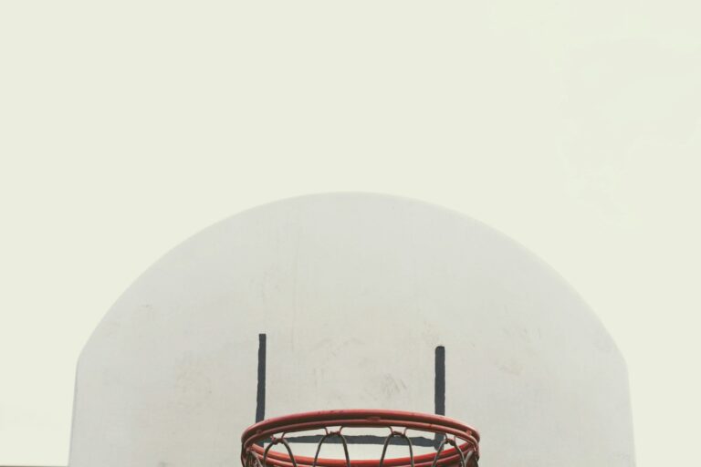 red metal frame on white round wall