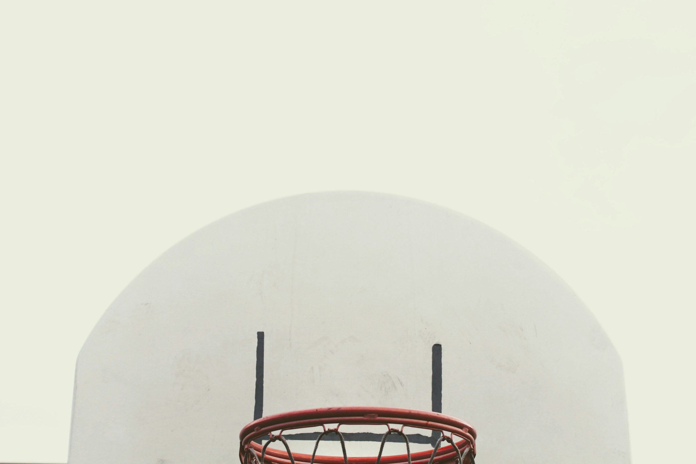 red metal frame on white round wall