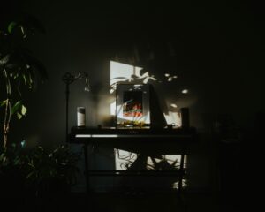 black flat screen tv turned on on black wooden tv rack