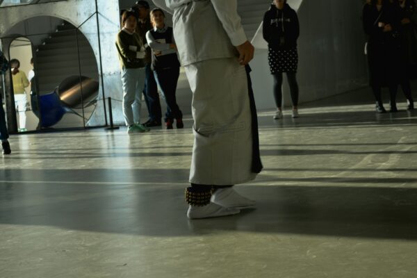 a group of people standing around in a room